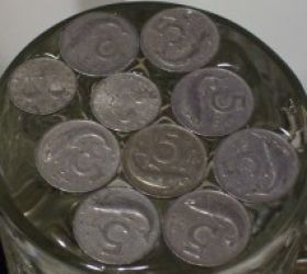 Floating-Aluminum-Coins-On-Water